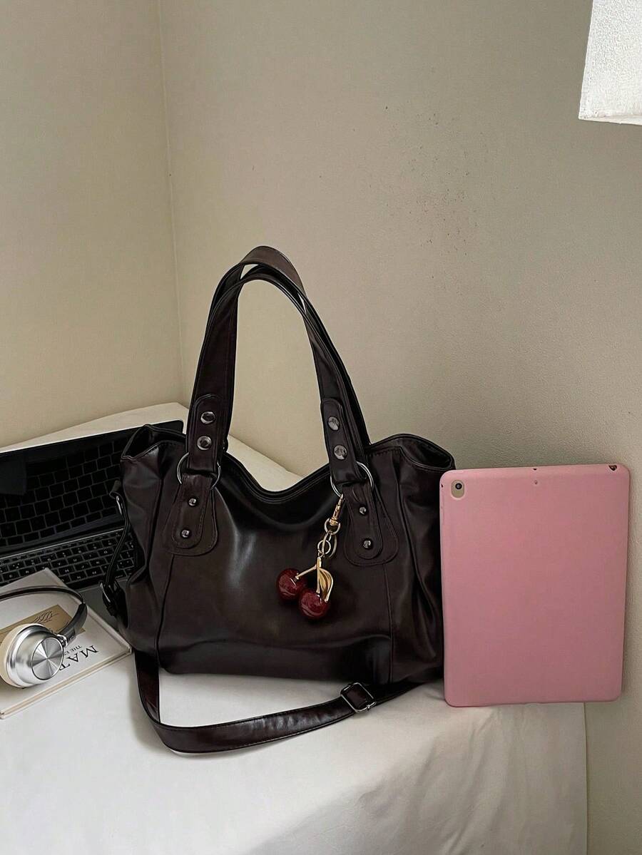 This Classic And Fashionable New Multi-Functional Solid Color Shoulder Bag Is Designed With A Large Capacity Vintage PU Material, Decorated With A Cherry Pendant, And Equipped With A Zipper, Making It