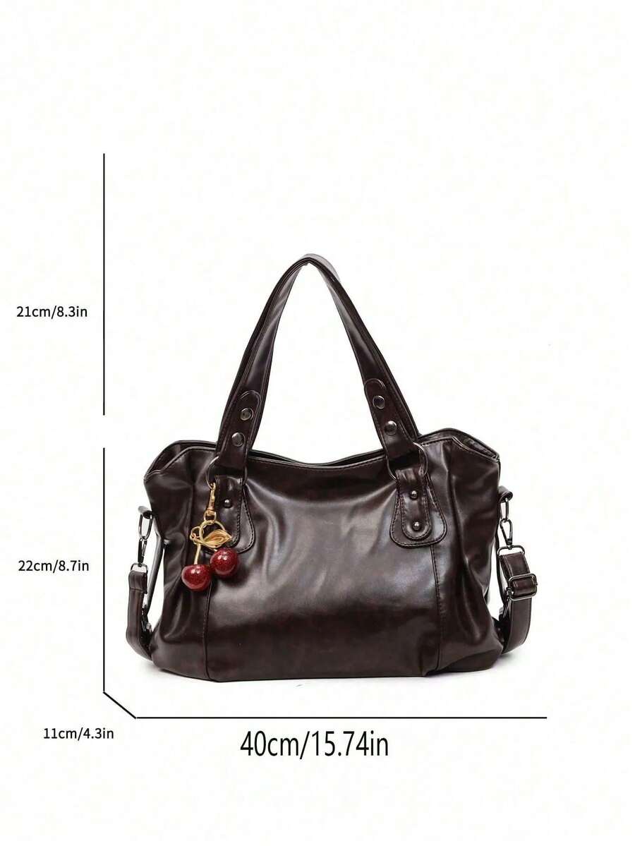 This Classic And Fashionable New Multi-Functional Solid Color Shoulder Bag Is Designed With A Large Capacity Vintage PU Material, Decorated With A Cherry Pendant, And Equipped With A Zipper, Making It