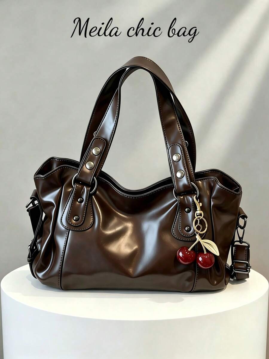 This Classic And Fashionable New Multi-Functional Solid Color Shoulder Bag Is Designed With A Large Capacity Vintage PU Material, Decorated With A Cherry Pendant, And Equipped With A Zipper, Making It