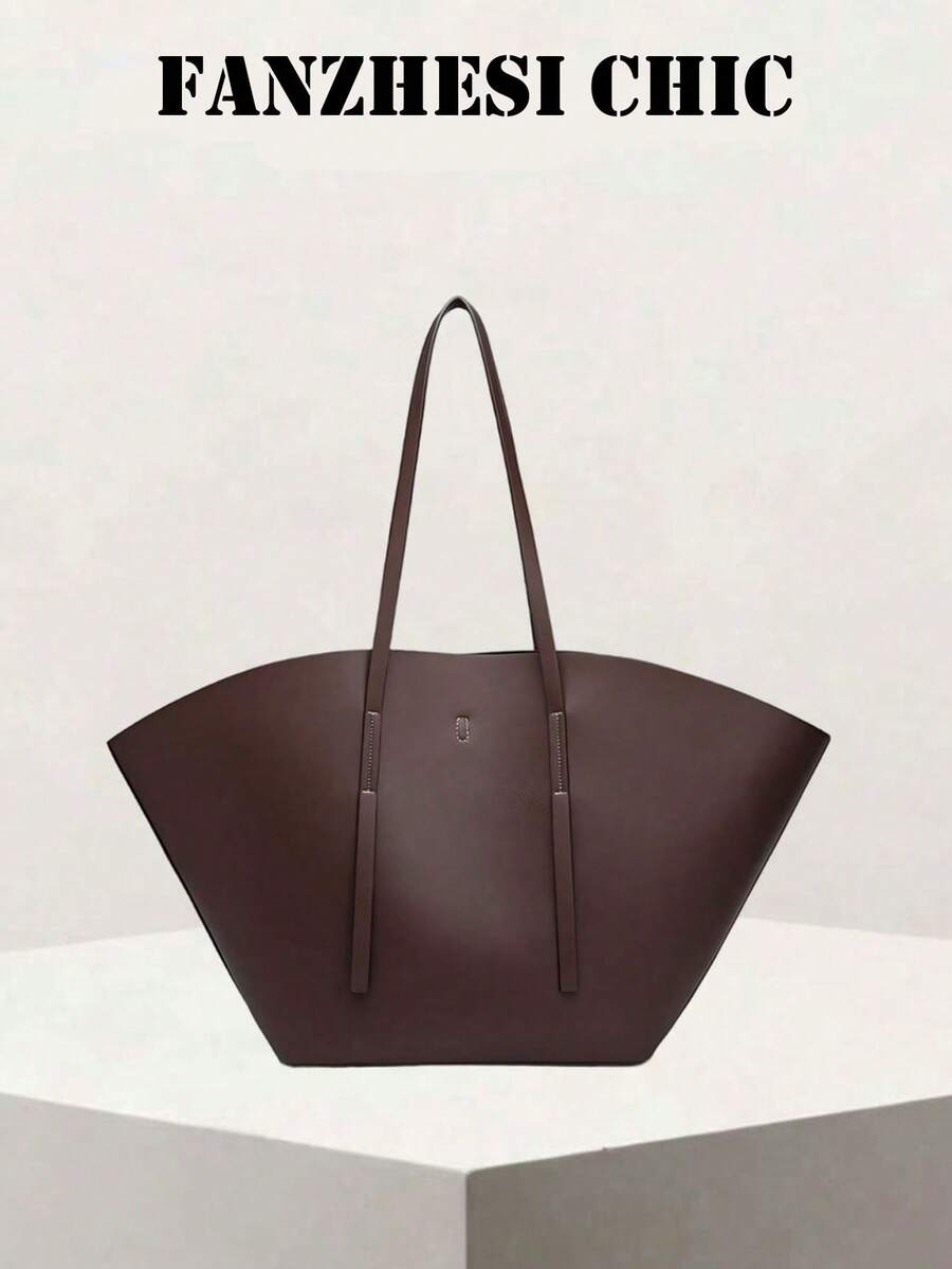 Distinctive Fan-Shaped Large Tote Bag With Wide Flared Silhouette, Reinforced Stitching At Shoulder Strap Attachment, Minimalist Embossed Logo On Front, Slim Shoulder Strap For Shoulder Carry, Open To