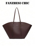 Distinctive Fan-Shaped Large Tote Bag With Wide Flared Silhouette, Reinforced Stitching At Shoulder Strap Attachment, Minimalist Embossed Logo On Front, Slim Shoulder Strap For Shoulder Carry, Open To